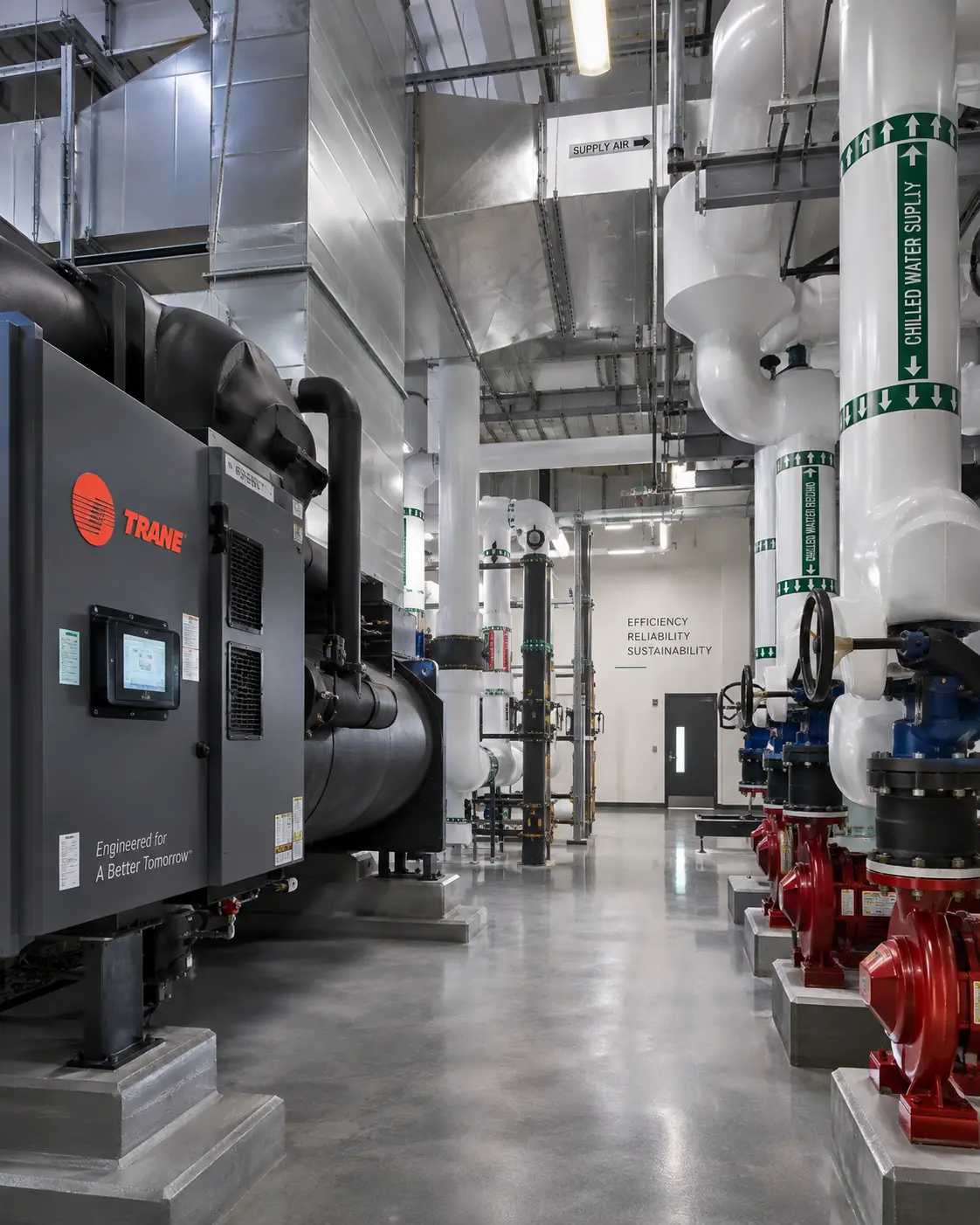 Mechanical engineers reviewing HVAC and building system plans - Roskani Engineering