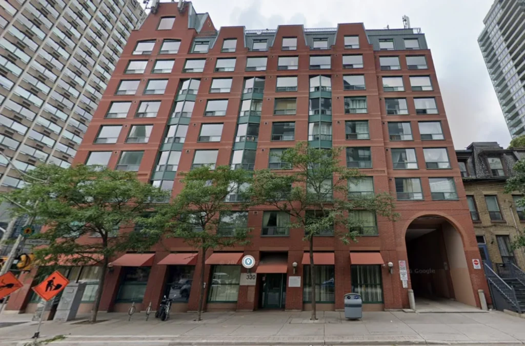 Red brick Toronto Community Housing building at 330 Jarvis Street, Toronto